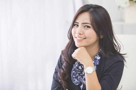 close up portrait of young business woman working on her officeの写真素材