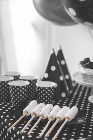 portrait of Black And White Birthday party decoration with full of cake and sweet candyの写真素材