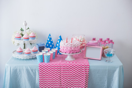 portrait of happy birthday concept of table with full of sweet candy and cakeの写真素材