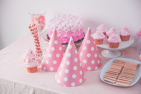 portrait of birthday party supplies. sweet corner with cake, lollies, cookies and candyの写真素材