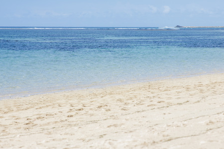 portrait of beautiful beach with clear blue skies and blue seaの写真素材