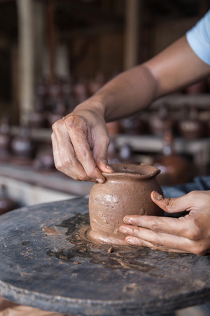 close up of hand forming a clay in workshopの写真素材