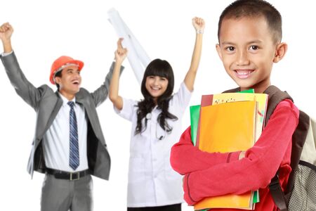 happy elementary student with books dreaming to be successful person in the futureの写真素材