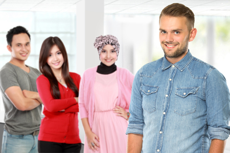 portrait of young asian male with his friend at the backgroundの写真素材