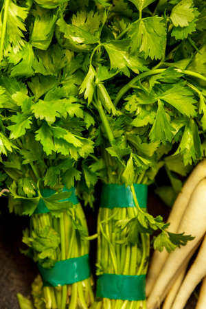 portrait of two bunch of fresh italian parsley at groceryの写真素材
