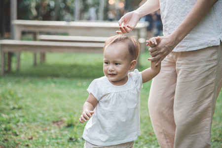 portrait of a Mother and her Child playing in Park togetherの写真素材