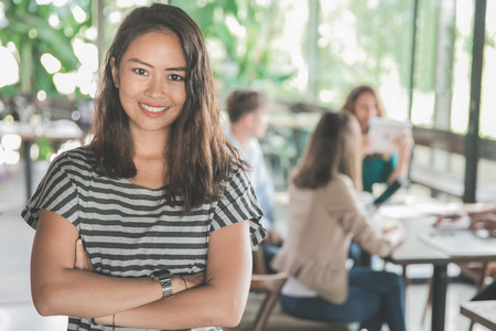 asian fresh graduate worker in her first business meeting in a cafeの写真素材