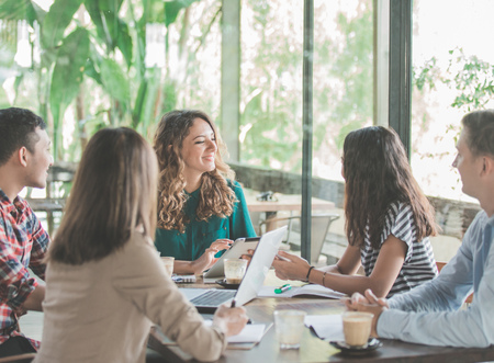 business creative designer brainstorming meeting in a cafeの写真素材
