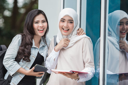 portrait of Asian university students on campus smiling to camera