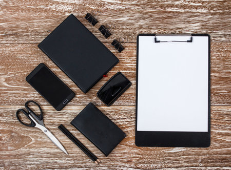 Corporate identity template on washed wooden table background