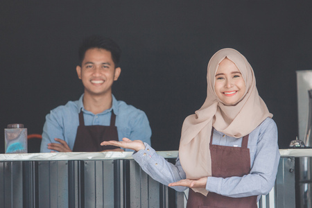 waitress welcoming customerの写真素材