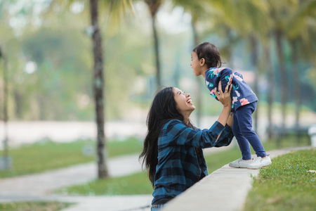 mother and kid enjoying outdoorの写真素材