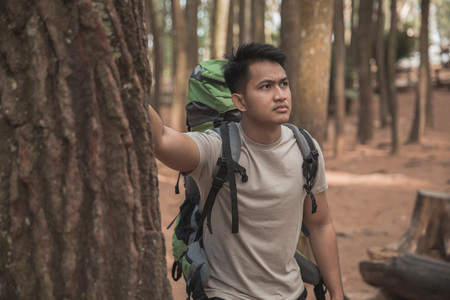 male hiker take a break while enjoying viewの写真素材