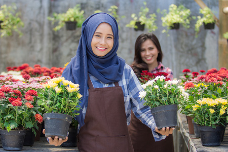 two asian florist in flower shopの写真素材