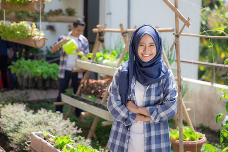 asian woman in rooftop farm or gardenの写真素材