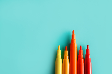 colorful markers isolated on pastel backgroundの写真素材
