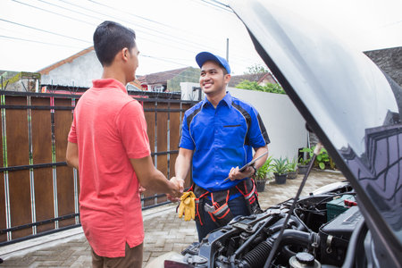 technician shake hand with customer