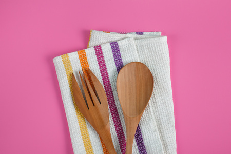 wooden serving spoon and fork with napkinの写真素材