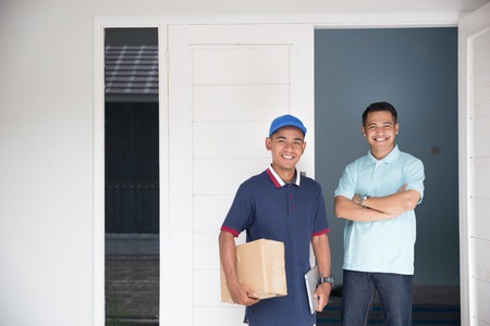 delivery service male and customer smilingの写真素材