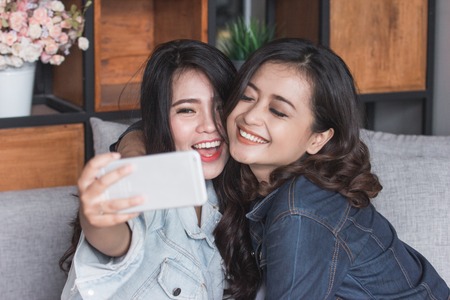 Two female friends selfieの写真素材