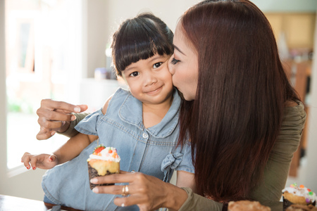 kid with parent cooking time in the kitchenの写真素材