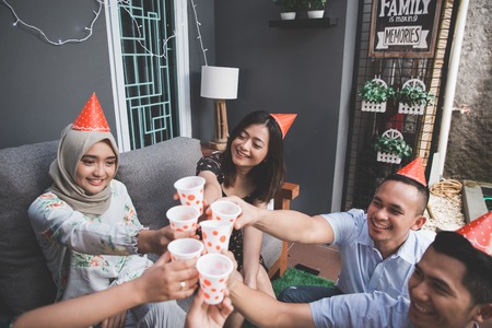 Group of friends enjoying party and cheers. celebrating and singing togetherの写真素材