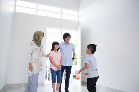 family entering new house to buyの写真素材