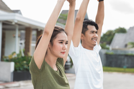 happy young asian people exercise and warm up