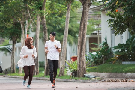 happy young asian couple exercise and warm upの写真素材