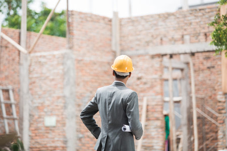 architect looking at his house the he build