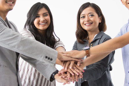 asian business people put hands together