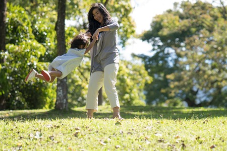 mom and daughter in the park enjoyの写真素材
