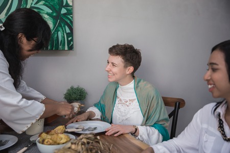 woman having lunch with friendsの写真素材