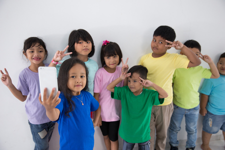 little kids best friend taking selfieの写真素材