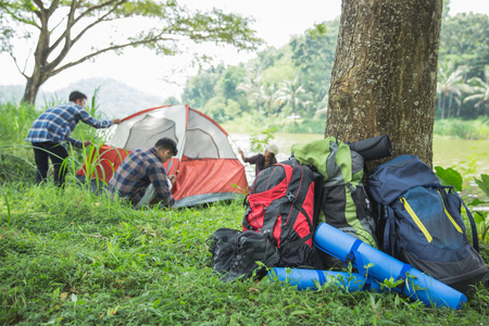 tourist help each other prepare tentの写真素材