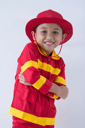A boy uniform as a fire fighterの写真素材