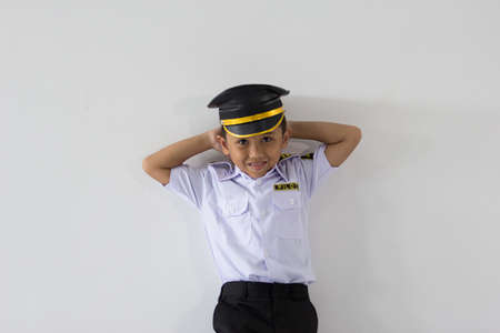 A boy who stood leaning against the wallの写真素材