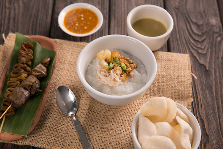 bubur ayam. chicken porridge with soupの写真素材