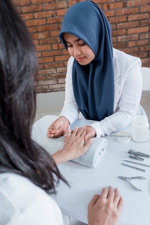 Hand manicure with nail fileの写真素材