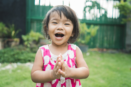 happy beautiful childs expression at home backyardの写真素材
