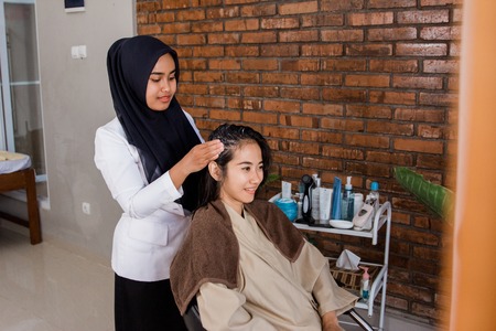 woman hair treatment in beauty salonの写真素材