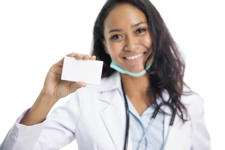 beautiful young doctor holding business cardの写真素材
