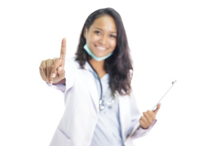 beautiful young doctor smiling while pretending like touching scの写真素材
