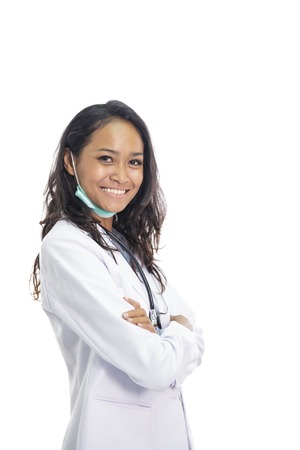 beautiful young doctor smiling with armcrossedの写真素材