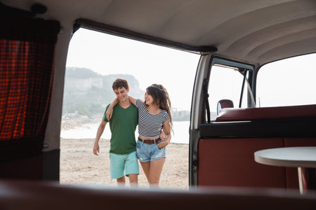 Hipster couple relaxing on her summer road trip