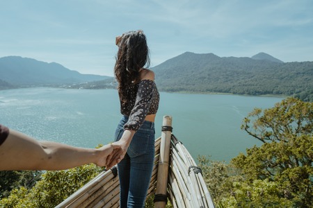 woman take her boyfriend by the handの写真素材