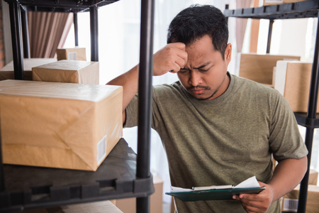 stress man while workingの写真素材