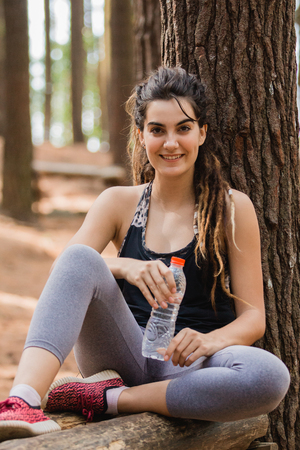 having some water after exercisingの写真素材