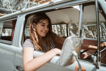 young woman on road trip on the beachの写真素材