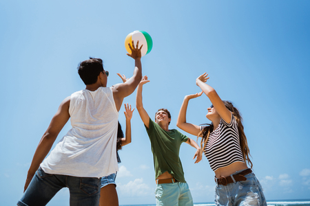 young people playing with volley ballの写真素材